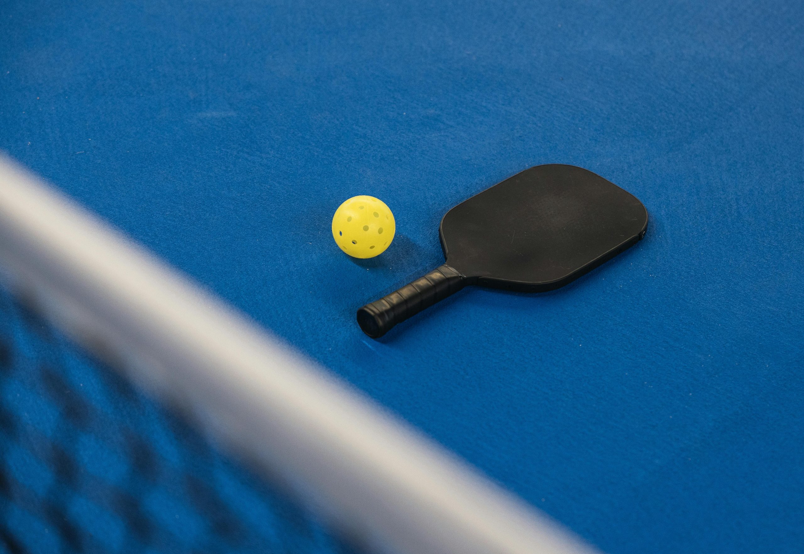 Close-up product shot of a custom pickleball paddle for premium product presentation