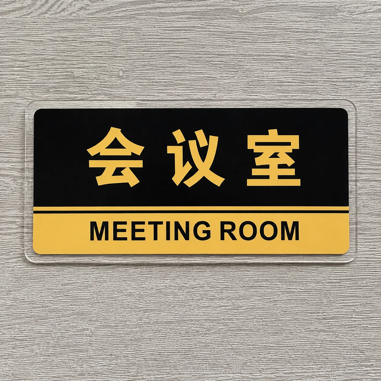 Custom acrylic meeting room sign with logo shape and UV printed content